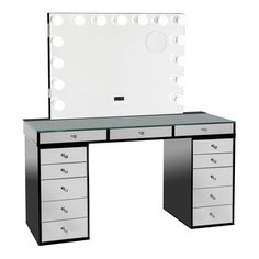 an illuminated vanity with drawers and mirror