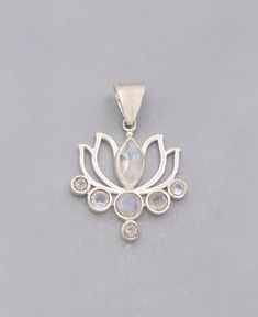 A poetic lotus flower glows with the soothing radiance of real moonstone. Rising through mud to blossom in the sun, the lotus represents transformation and triumph over obstacles. A gentle stone, moonstone vibrates with a calming energy that inspires emotional balance and inner harmony. Wear this beautiful blossom to maintain a sense of inner calm through obstacles big and small: find your balance, bloom. Made of sterling silver, pendant measures about 1 inch wide and 1 inch long. Lotus gemstone Inner Harmony, Buddha Jewelry, Lotus Pendant, Lotus Design, Silver Jewelry Design, Meaningful Jewelry, The Lotus, Yoga Jewelry, Moonstone Pendant