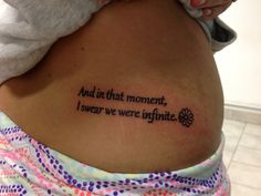 a woman with a tattoo on her stomach that says and in that moment, i swear we're infinite