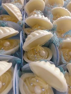 several pieces of soap with pearls on them are arranged in the shape of hearts and seashells