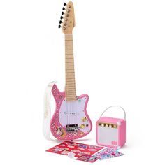 a pink guitar and its accessories on a white background with a hello kitty sticker next to it