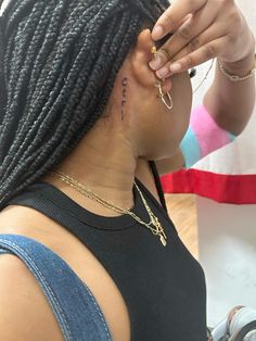 a woman is getting her hair done at the salon