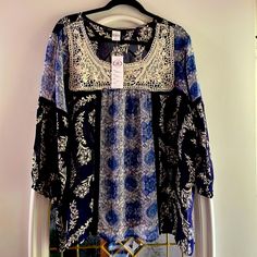 Lightweight, Sheer, Navy Blue With White Crochet Overlay On Front Of Blouse. Long Sleeve With Navy Lace About 1” Past Armpit.Stretch Elastic At End Of Sleeve. 100%Rayon, Made In India. Hand Wash In Cold Water. Color Is Medium Blue, Navy Blue And White On Front Chest. Blue Tunic Top For Vacation, Blue Floral Print Tunic Top, Blue Bohemian Tunic Top, Blue Tunic Blouse For Vacation, Blue Tunic Blouse For The Beach, Floral Peasant Top, Floral Peasant Blouse, Crochet Overlay, White Floral Blouse