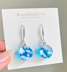 These earrings capture the beautiful blue sky on a 925 sterling silver plated ear wire/ 18k gold plated brass. Made with jewelry grade resin filled with fluffy lifelike clouds in a 15mm sphere You can carry a little piece of the sky wherever you are! Every piece is handmade from start to finish making each piece unique and slightly differ from each jewelry piece Weather Earrings, Sky Blue Earrings, Cloud Jewelry, Xmas Letter, Sky Jewelry, Fullerton California, Cloud Earrings, Blue Sky Clouds, Resin Jewelry Diy