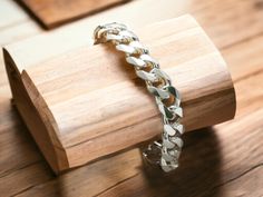 Discover timeless elegance and impeccable craftsmanship with our 925 Sterling Silver Men's Solid Cuban Curb Link Chain Bracelet. Crafted from high-quality sterling silver, this bracelet boasts a sturdy 11mm width and a classic Cuban curb link design, making it a versatile and stylish accessory for any occasion. Whether you're dressing up for a formal event or adding a touch of sophistication to your everyday attire, this bracelet is sure to make a statement. Each link is meticulously handcrafted Link Design, Link Chain Bracelet, Jewelry For Men, Sterling Silver Mens, Silver Man, Chain Link Bracelet, Stylish Accessories, Link Chain, Formal Event