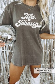 This custom comfort colors retro bride shirt is the perfect bachelorette top for your honeymoon and to announce your new last name as a just married couple! ⭐️ * I T E M * I N F O* ✦ Comfort Colors Unisex Shirt ✦ 100% Ring-Spun Cotton ✦ Printed using Direct To Garment style- Inks are printed directly into the fabric. ✦ Different sizing may effect placement of final design. ✦ Colors may differ slightly due to different user monitor and screen settings. 📏 * S I Z I N G * ✦ Shirts are true-to-size Summer Cotton Tops For Anniversary, Cotton Tops For Summer Anniversary, Cotton Tops For Anniversary In Summer, Retro Summer Tops For Anniversary, Mr And Mrs Tshirt, 70s Bride, Last Name Shirt, Just Married Tshirts Couple, Bachelorette Tops