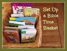 a basket filled with books sitting on top of a wooden table