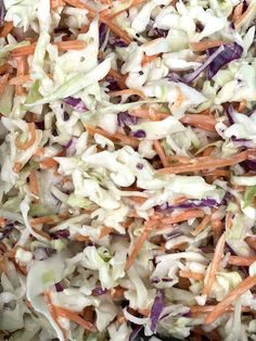 coleslaw is mixed with carrots and cabbage