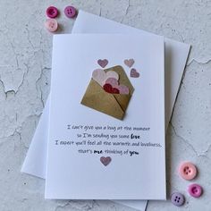 two valentine's day cards, one with a envelope and the other with hearts