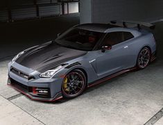 a gray sports car parked in a garage