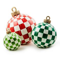 three christmas ornaments are sitting next to each other