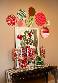 a table topped with lots of christmas decorations and ornaments on top of it's side