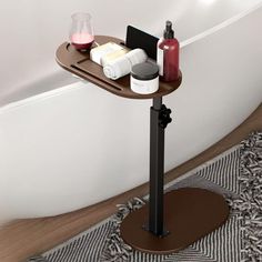 there is a small table with some items on it in front of the bathtub