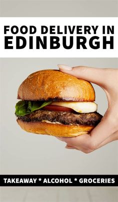 a hand holding a hamburger with lettuce, tomato and cheese on it that says food delivery in edinburgh takeaway & alcohol groceries