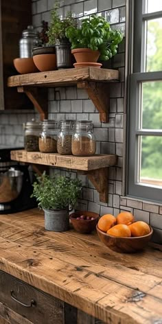 the kitchen counter is made out of wood and has two shelves with plants on them