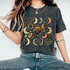 Watercolor Moon Phase Tee in Comfort Colors with 15 Unique and Playful Phases: Introducing our beautiful and whimsical Moon Phase T-shirt, perfect for anyone who loves celestial designs and wants to add a touch of magic to their wardrobe. Featuring 15 different fun and playful moon phases scattered across a stunning watercolor print, this t-shirt is truly one-of-a-kind. The eye-catching watercolor print features 15 unique and playful moon phases, each one more whimsical and fun than the last. The soft, muted colors of the print blend beautifully with the vintage-inspired Comfort Colors material, giving the shirt a classic, rustic feel. Whether you're a lover of all things celestial or just looking for a fun and playful shirt to add to your collection, our Moon Phase T-shirt is the perfect Whimsical Moon, Bohemian Shirt, Celestial Shirt, Moon Lover, Boho Moon, Moon T Shirt, Moon Gifts, Moon Shirt, Moon Lovers