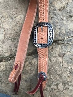 "Hand made 1.5\" wide headstall with buckle. These headstalls are made in our shop and are made to order. Buckles may vary as inventory changes and new styles are released. They are made from Heavy 14/16 ounce Herman Oak leather. Embossed with the Western Floral, Basketweave, Plain, and soon barbwire. Jermiah Watt Hardware is used and is top quality stainless steel hardware. These headstall get compliments wherever you go and a great using piece of tack." Adjustable Western Concho Belt Buckles, Adjustable Concho Belt Buckles For Western-themed Events, Western Brown Adjustable Belt Buckles, Traditional Adjustable Brown Belt Buckles, Adjustable Brown Traditional Belt Buckles, Western Adjustable Belt Buckles For Rodeo, Western Style Adjustable Belt Buckles For Rodeo, Adjustable Brown Belt Buckles For Rodeo, Rustic Hand Tooled Adjustable Belt Buckles