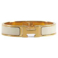 Hermès Clic H PM Bracelet in Creme and Gold Wrist size: 16.8 cm Width: 12 mm Made in France Hermes Clic Hh Bracelet, Gold Hermes Bracelet, Euro Winter, H Bracelet, Hermes Bracelet, Modern Bracelets, Christmas 2024, Fresh Start, Designer Jewelry