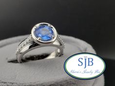 Previously Loved🥰Not New 🔵Vintage Spinel &💎Ring🔵 A FABULOUS Vintage Find Built in all Shimmering 950 Platinum 🪩 Featuring a FANTASTIC and Timeless Engagement/Anniversary Ring Design. Prong set with a SPECTACULAR Sparkling Genuine/Natural Blu Spinel 🔵 Gemstone center weighing in at 1.00ct  surrounded with a Shining Halo of Platinum with Sparkling Genuine/Natural Earth 🌎 Diamond on both  sides of the center  totaling .21cts together. Measuring in at approximately 9.3mm at the widest. This A Collectible Platinum Sapphire Ring, Collectible Fine Jewelry Round Sapphire Ring, Collectible Sapphire Ring With Center Stone, Collectible Round Sapphire Ring With Center Stone, Classic Blue Ring With Bezel Setting, Platinum Blue Ring With Bezel Setting, Blue Platinum Rings With Bezel Setting, Heirloom Blue Rings With Bezel Setting, Collectible White Gold Sapphire Ring