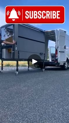 a man standing in front of a truck with the door open and it's doors open