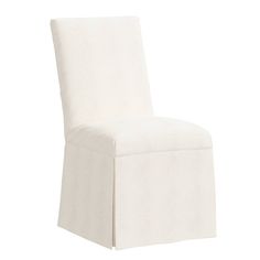 a white chair that is upholstered with a skirt on the back and legs