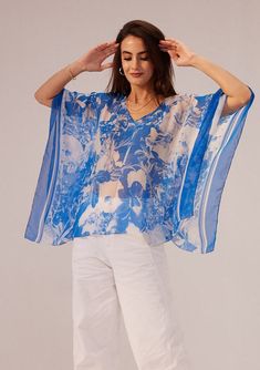 Reena Sharma | Azure Blue Kaftan Top | INDIASPOPUP.COM Chic Printed V-neck Kaftan, Chic Flowy Top For Beach Cover-up, Casual Printed Top For Beach Cover-up, Spring Batwing Sleeve Kaftan, Elegant Spring Kaftan With Batwing Sleeves, Flowy Tunic Tops For Vacation, Blue Batwing Sleeve Summer Tops, Summer Kaftan With Batwing Sleeves, Elegant Printed Tops For Vacation