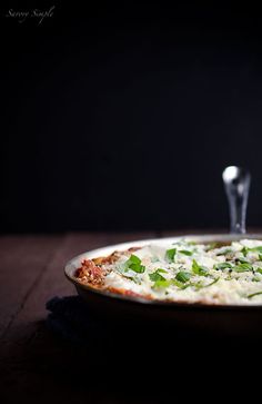 a pizza sitting on top of a pan covered in cheese