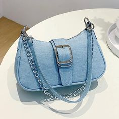 Double Strap - One Chain And One Blue Denim Strap. Material - Denim Closure Type - Zipper Composition- 100% Polyurethane New With Tag Light Blue Wash Cheap Light Blue Bag With Detachable Strap, Trendy Blue Denim Shoulder Bag, Trendy Blue Shoulder Baguette Bag, Trendy Blue Baguette Shoulder Bag, Trendy Blue Baguette Bag For Everyday, Trendy Blue Crossbody Baguette Bag, Chic Blue Denim Shoulder Bag, Chic Denim Blue Shoulder Bag For Spring, Casual Blue Baguette Bag For Daily Use