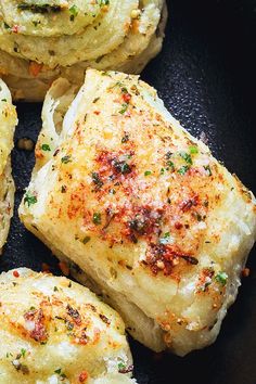 some food is cooking in a pan on top of the stove and it looks like they have been cooked