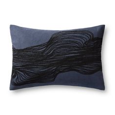 a black and blue pillow with wavy lines on it