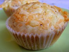 two muffins sitting on top of a green plate