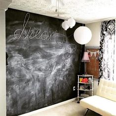 a chalkboard wall with the word dream written on it