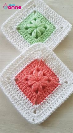 two crocheted squares with flowers on them