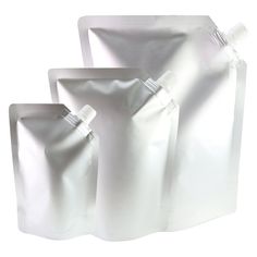 three white bags are shown on a white background