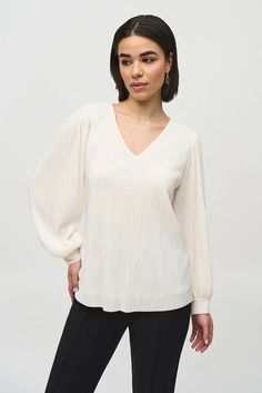 With romantic pleating, delicate puffed sleeves, and a lovely novelty knit, this v-neck top pairs beautifully with jeans for a casual-chic day look. DETAILS & CARE 100% Polyester Novelty knit V-neck Long puff sleeves with cuffs Pleated Lined Hand wash in cold water with like colors Do not bleach Hang to dry in the shade Do not tumble dry Do not iron Do not dry clean Wash garment inside out White Ribbed Top, Pleated Knit, Joseph Ribkoff, Ribbed Top, Long Puff Sleeves, Puffed Sleeves, The Chic, Polished Look, White Fabrics