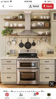 a stove top oven sitting inside of a kitchen next to wooden shelves filled with pots and pans