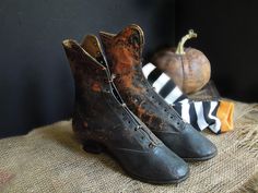 Antique Victorian 1850s - 1870s Young Woman's Shoes / Black and Brown Lace Up Above Ankle Boots  / Victorian Leather Boots Halloween Decor Antique black young girl's or women's over the ankle boots with a fabulous slight scooped top edge design and rounded square tips.  The boots have holes for the laces that would tie them up although they do not have laces which could be added but they are secured closed in a couple of spots.  The shoes are in antique condition, they do have wear...they are without holes.  These are ideal for your Halloween decor.  They measure~~  Toe to heel about 8.5" x approx.7.5" tall I ship worldwide contact me for shipping rates, send me your country city and postal code. As with all vintage items they are full of fabulous patina, love and age, this is what all of Above Ankle Boots, Over The Ankle Boots, Boots Victorian, Antique Shoes, Postal Code, Adored Vintage, Rounded Square, Victorian Women, Girls Boots