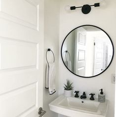 a bathroom sink with a mirror above it