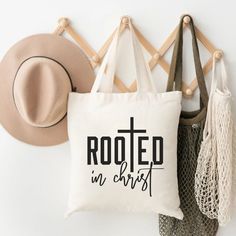 Carry your faith wherever you go with this "Rooted In Christ" Christian graphic tote bag. Perfect for church, Bible study, or everyday use, this durable and stylish bag showcases your spiritual devotion with a bold, faith-based design. Made from high-quality materials, it’s both practical and meaningful, making it an ideal gift for believers or a personal statement of faith. Whether you're running errands or attending a fellowship event, this tote bag is a reminder of your deep roots in Christ. Personal Statement, Graphic Tote, Faith Based, Stylish Bag, Running Errands, Bible Study, Bag Accessories, Spirituality, Bible