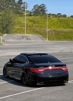 a black car parked in a parking lot