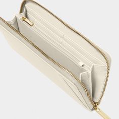 Designed with vegan leather Main inner compartment with six internal card slots Dimensions: 4" x 7 7/8" x 1" By Katie Loxton London Everyday Wallet by Katie Loxton Katie Loxton, Silky Pants, Personalized Gift Bags, Vacuum Accessories, Safe Storage, Cute Purses, Shoe Gifts, Monogram Styles, Classic Gold