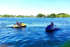 two people on jet skis in the water