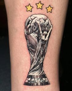 a close up of a person's leg with a tattoo on it and three stars