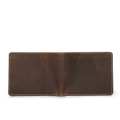 Introducing our new Liard wallet – a distinctive trifold wallet handcrafted of full-grain crazy horse leather. This striking fold-over wallet is available in both Tan and Chestnut. Thanks to the exclusive color-changing ability of authentic crazy horse leather, both tempting colors offer the assurance that your wallet will be uniquely yours. This slim wallet offers six convenient cardholders, two note compartments, two slip pockets, and one large plus one small I.D. window. The Liard is R.F.I.D. Leather Trifold Wallet, Slim Wallet, Crazy Horse, Trifold Wallet, Leather Care, Natural Leather, Wallet Men, Chestnut, Leather Handmade