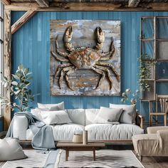 a living room filled with furniture and a large crab painting on the wall above it