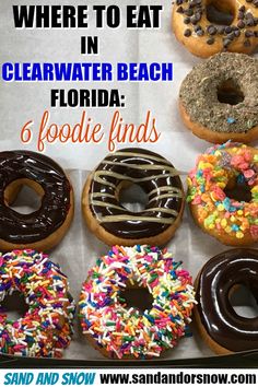 there are many donuts in the box with words on it that say, where to eat in clearwater beach florida fodie finds