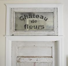 an old door with the word chateau de fleurs painted on it