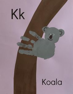 a child's drawing of a koala on a tree with the letter k