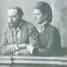 an old black and white photo of two people