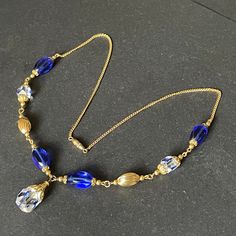 Blue Briolette Necklace For Wedding, Elegant Blue Wire Wrapped Beaded Necklaces, Gold Czech Glass Single Strand Jewelry, Vintage Gold Wire Wrapped Necklace, Vintage Gold Beaded Crystal Necklaces, Elegant Blue Wire Wrapped Beaded Necklace, Gold Necklace With Faceted Glass Beads, Gold Single Strand Czech Glass Necklace, Vintage Gold Briolette Necklace